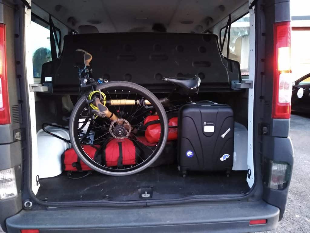 Bamboo bike squashed in the back of minivan taxi
