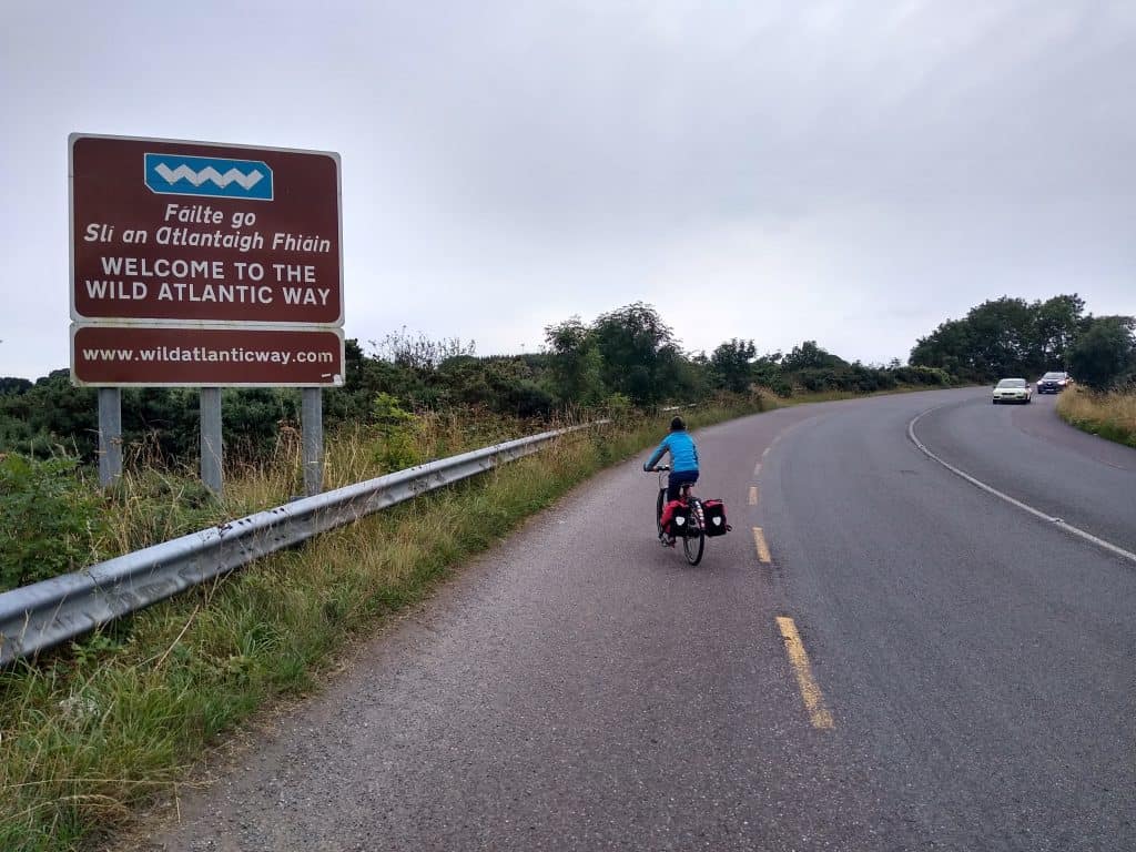 Cycling past big welcoming sign to the Wild Atlantic Way