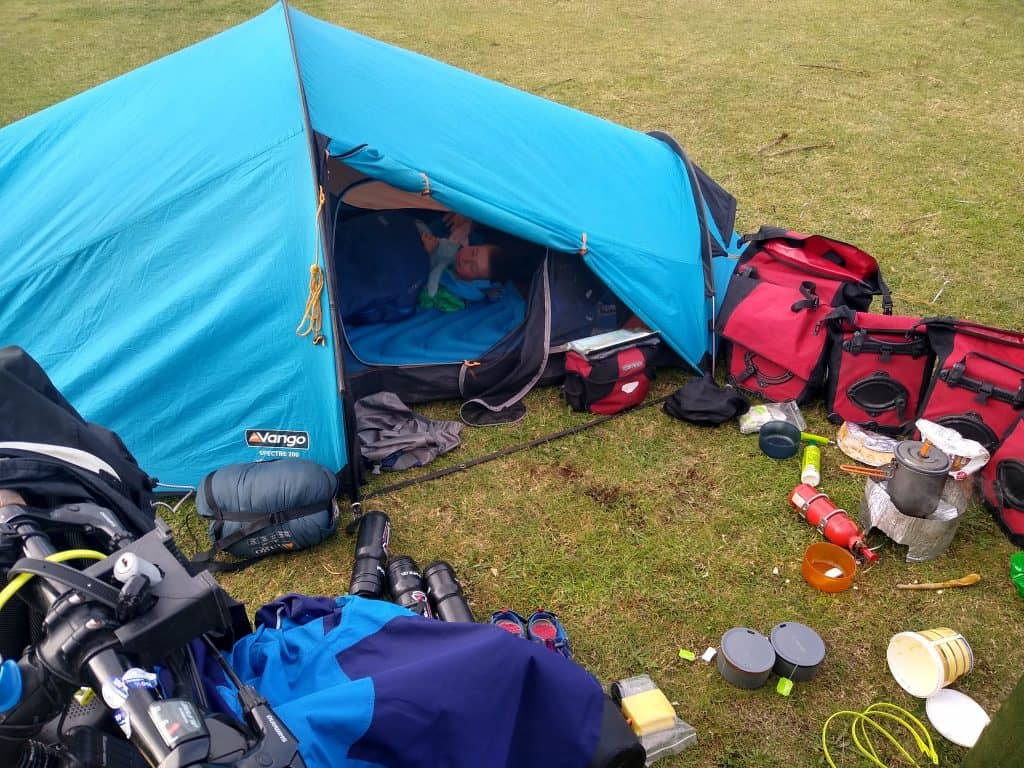 R fast asleep in tent cuddling Bluebell